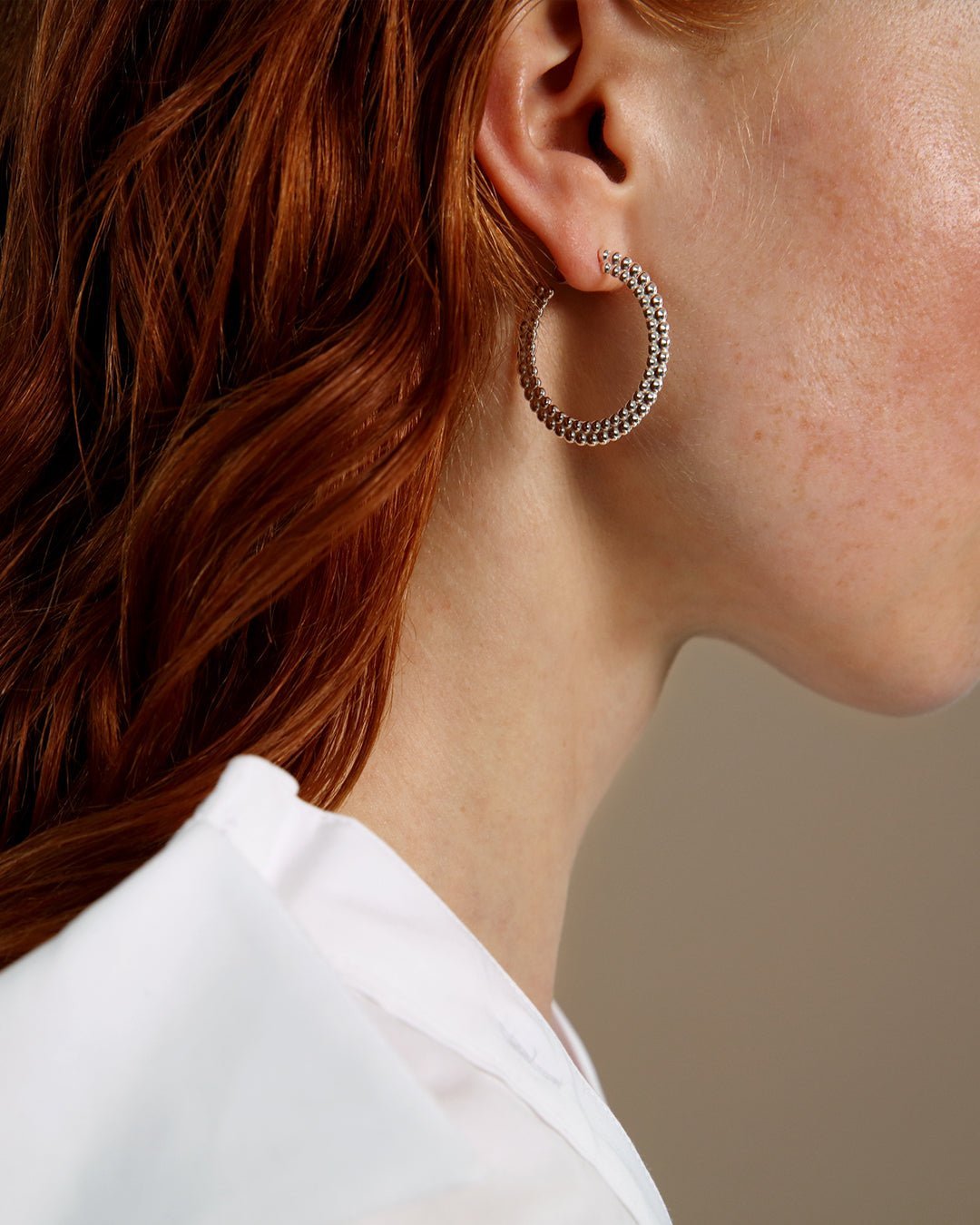 Circle of Light big hoop Earrings silver half pair right