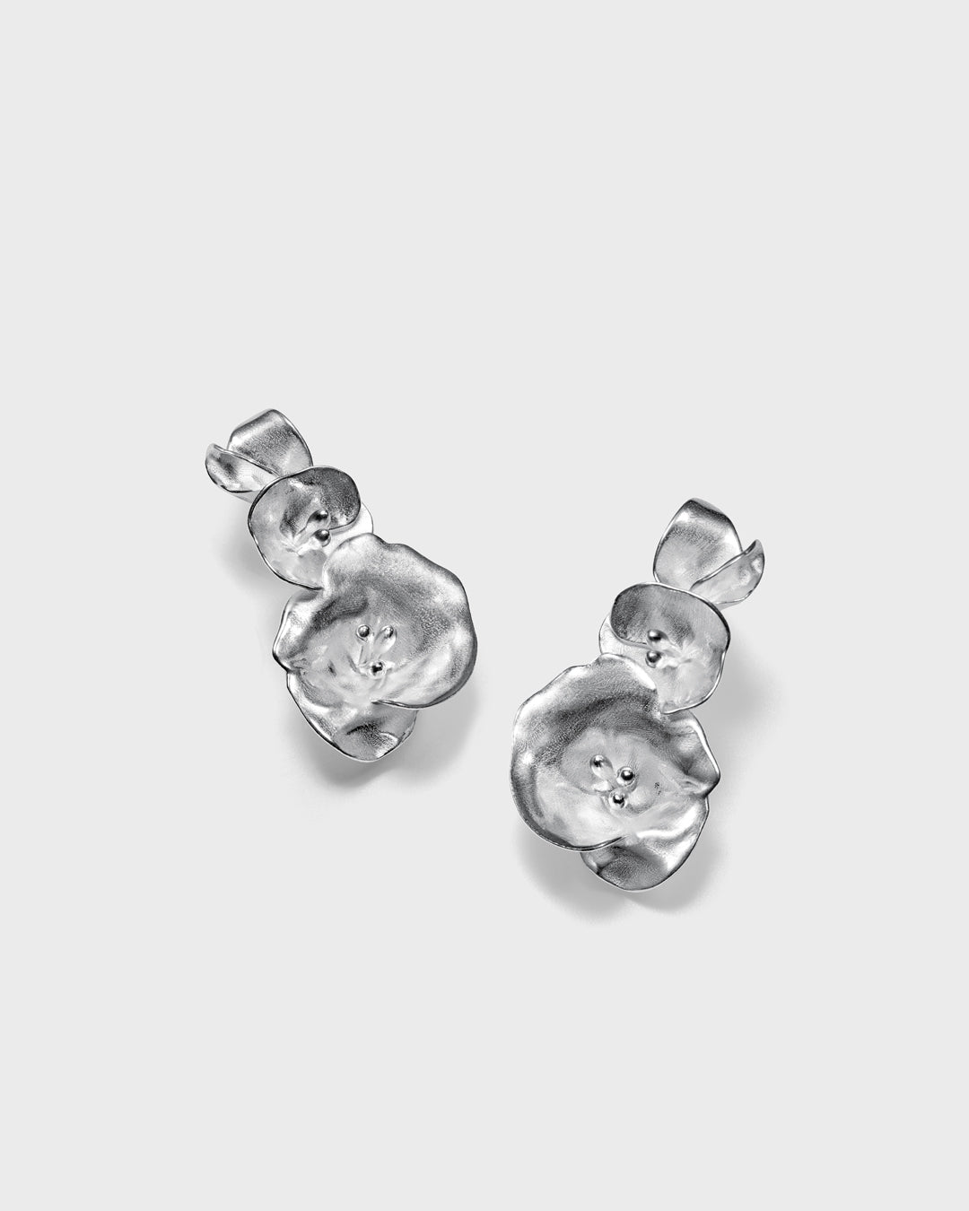 Summer night rose earrings large silver half pair left