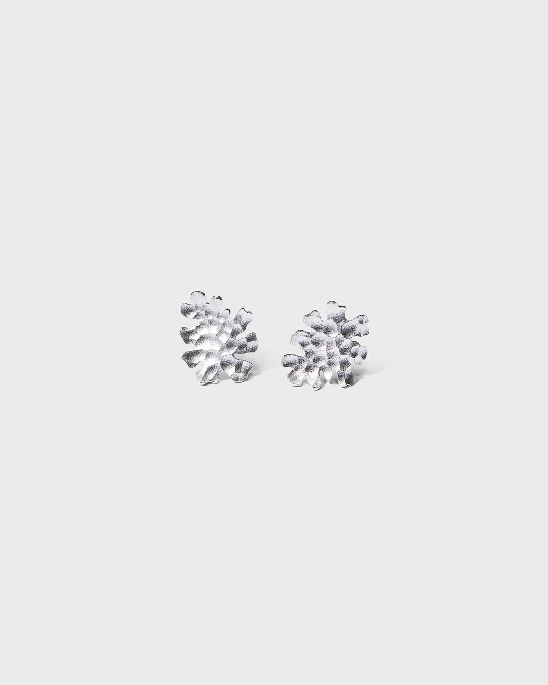 Tundra earrings small silver half pair left