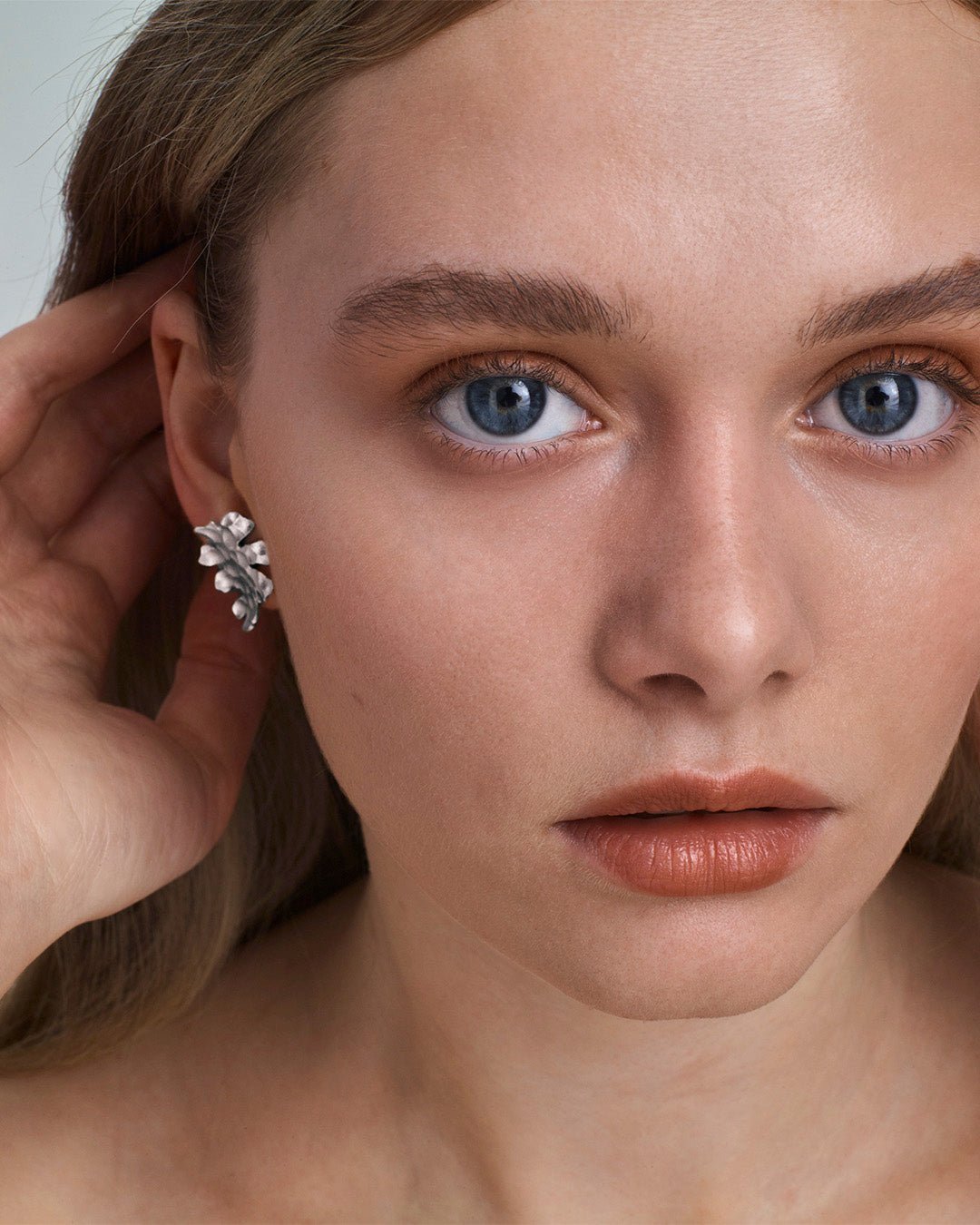 Tundra earrings small bronze half pair left
